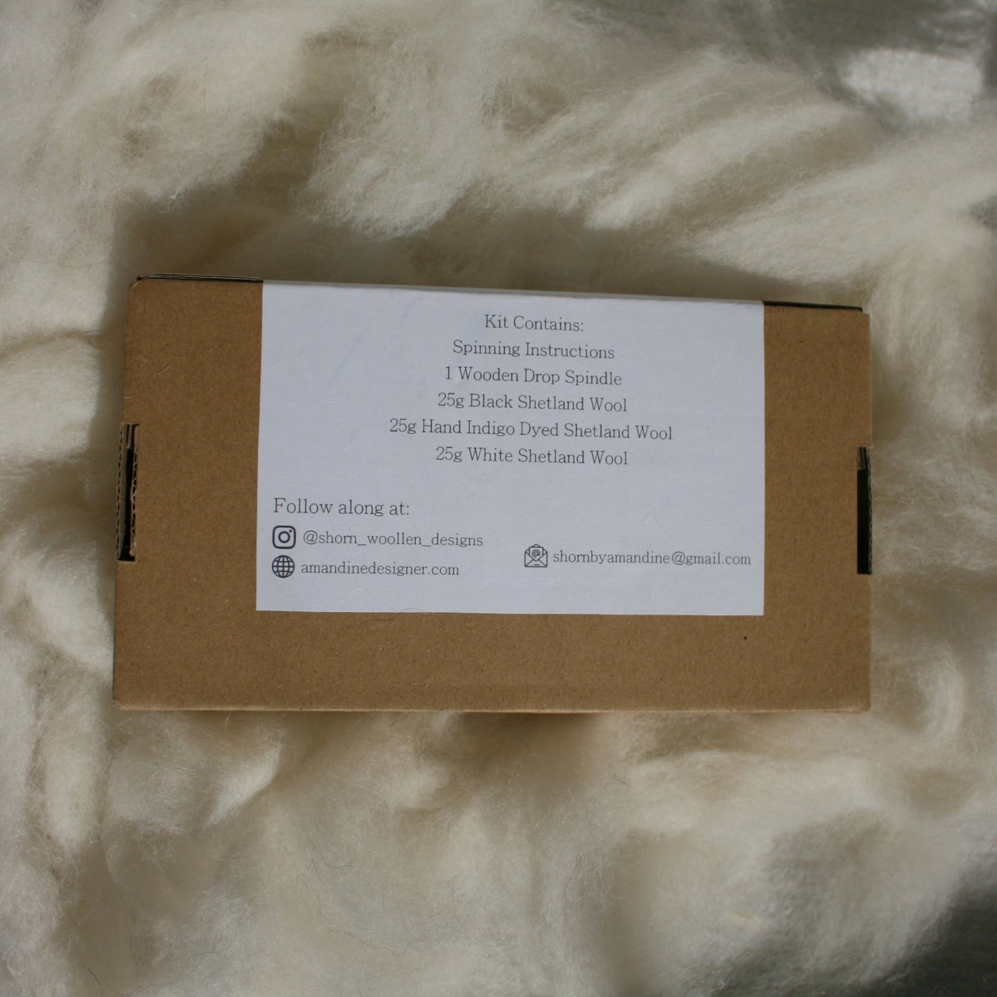 Cardboard box with a label on a textured fabric background